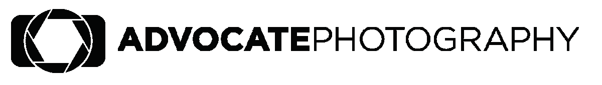 Logo of a white camera for Advocate Photography