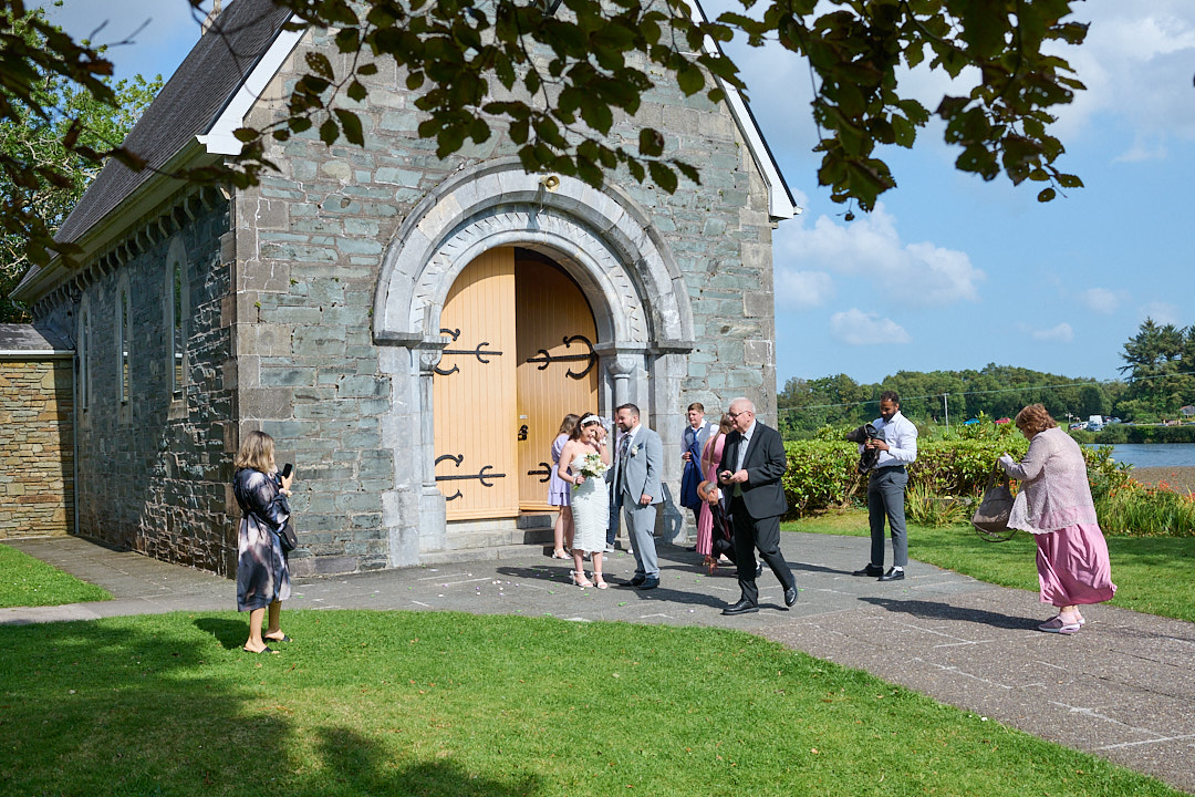 Gouganne Barra church and the wedding party stand outside